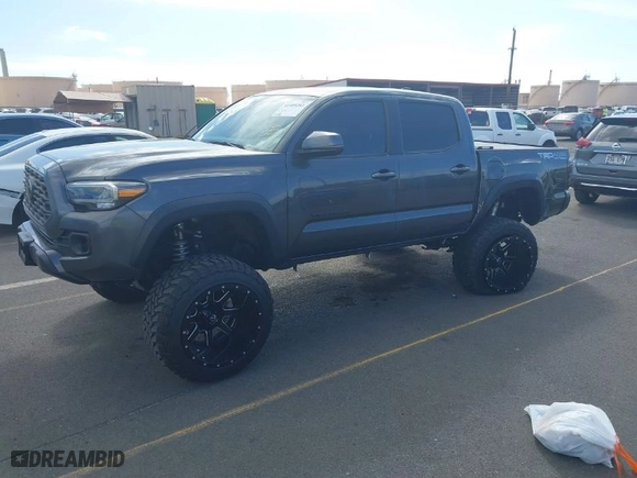 2021 Toyota Tacoma 4WD SR with VIN 3TMCZ5ANXMM447464, listed as a IAAI auction lot 41409203 with 39,390 mi miles. Bid and sale history available at carsss.com. Image 2.