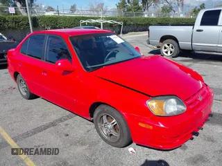 2003 Hyundai Accent GL with VIN KMHCG45C93U487209, listed as a IAAI auction lot 41590636 with 118,811 mi miles. Bid and sale history available at carsss.com. Image 1.