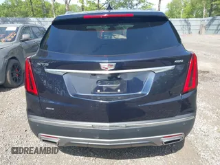 2021 Cadillac XT5 AWD Premium Luxury z VIN 1GYKNDRS8MZ217572, wystawiony jako IAAI lot #42190571 z przebiegiem 25 100 mil mil oraz . Historia ofert i sprzedaży dostępna na DreamBid. Obrazek 16.