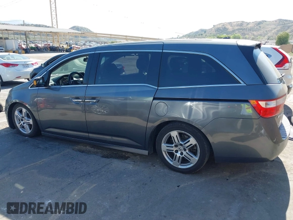 2011 Honda Odyssey Touring with VIN 5FNRL5H96BB009580, listed as a IAAI auction lot 42202595 with Not provided miles and . Bid and sale history available at DreamBid. Image 14.
