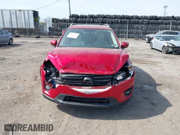 2016 Mazda CX-5 Grand Touring with VIN JM3KE4DY9G0850583, listed as a IAAI auction lot 42075545 with 92,789 mi miles and . Bid and sale history available at carsss.com. Image 6.