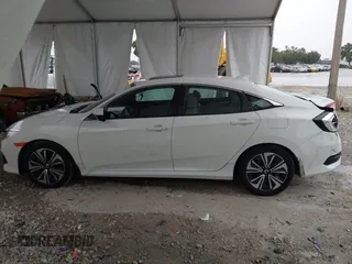 2017 Honda Civic EX-L z VIN 19XFC1F78HE025582, wystawiony jako IAAI lot #42432134 z przebiegiem 144 688 mil mil oraz . Historia ofert i sprzedaży dostępna na DreamBid. Obrazek 14.