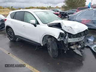 2016 Mazda CX-5 Grand Touring with VIN JM3KE4DY0G0705691, listed as a IAAI auction lot 40880798 with 130,624 mi miles. Bid and sale history available at carsss.com. Image 1.