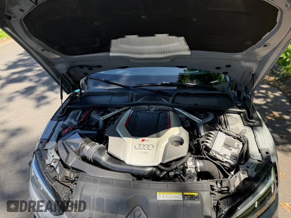 2018 Audi RS 5 z VIN WUAPWAF50JA904659, wystawiony jako Copart lot #57560835 z przebiegiem 88 168 mil mil oraz Tytuł czysty. Historia ofert i sprzedaży dostępna na DreamBid. Obrazek 7.