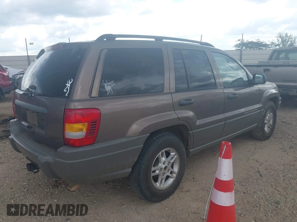 2002 Jeep Grand Cherokee Laredo with VIN 1J4GX48S32C168105, listed as a IAAI auction lot 42451373 with 293,790 mi miles and . Bid and sale history available at DreamBid. Image 4.