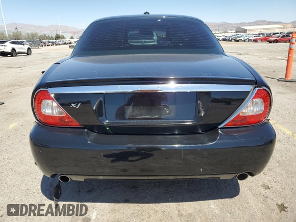 2009 Jaguar XJ 8 with VIN SAJWA71B79SH30431, listed as a Copart auction lot 52403185 with 67,143 mi miles and Salvage Title. Bid and sale history available at DreamBid. Image 6.