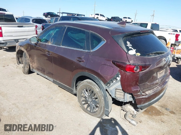 2019 Mazda CX-5 Sport with VIN JM3KFABM2K0686372, listed as a IAAI auction lot 41770183 with 57,202 mi miles and . Bid and sale history available at DreamBid. Image 3.