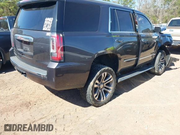 2018 GMC Yukon Denali with VIN 1GKS2CKJ6JR303263, listed as a IAAI auction lot 41633514 with 130,990 mi miles. Bid and sale history available at carsss.com. Image 4.