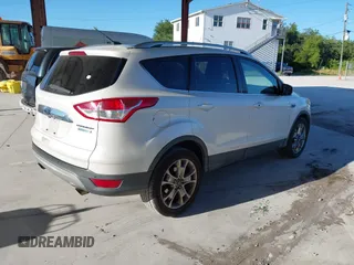2015 Ford Escape Titanium with VIN 1FMCU0J96FUA48615, listed as a IAAI auction lot 39482355 with 186,340 mi miles and . Bid and sale history available at DreamBid. Image 4.