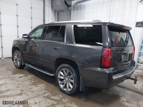 2016 Chevrolet Tahoe LTZ with VIN 1GNSKCKC7GR455033, listed as a IAAI auction lot 40811560 with 165,845 mi miles. Bid and sale history available at carsss.com. Image 3.