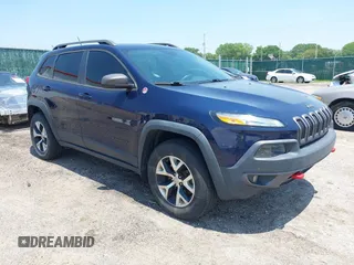 2015 Jeep Cherokee Trailhawk z VIN 1C4PJMBS3FW704622, wystawiony jako IAAI lot #42465702 z przebiegiem 96 831 mil mil oraz . Historia ofert i sprzedaży dostępna na DreamBid. Obrazek 1.