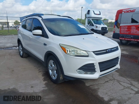 2014 Ford Escape SE with VIN 1FMCU0GX2EUA02753, listed as a IAAI auction lot 42191334 with 205,289 mi miles. Bid and sale history available at carsss.com. Image 1.