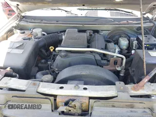 2004 GMC Envoy SLE with VIN 1GKDT13S042113411, listed as a IAAI auction lot 42117824 with 116,827 mi miles. Bid and sale history available at carsss.com. Image 10.