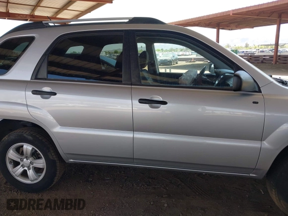 2009 Kia Sportage LX with VIN KNDJF724297601801, listed as a IAAI auction lot 42063474 with 87,869 mi miles. Bid and sale history available at carsss.com. Image 13.