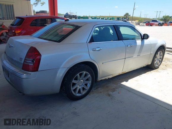 2005 Chrysler 300 with VIN 2C3AA63HX5H125777, listed as a IAAI auction lot 41843281 with 115,034 mi miles. Bid and sale history available at carsss.com. Image 4.