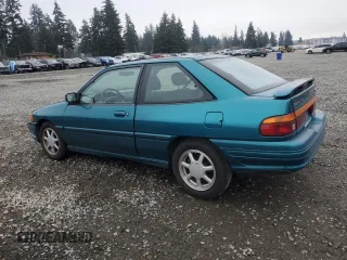 1995 Ford Escort z VIN 1FASP1284SW307142, wystawiony jako Copart lot #88531955 z przebiegiem 93 323 mil mil oraz Szkoda całkowita • Salvage title. Historia ofert i sprzedaży dostępna na DreamBid. Obrazek 2.