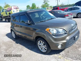2012 Kia Soul + with VIN KNDJT2A60C7472303, listed as a IAAI auction lot 42126057 with 308,726 mi miles. Bid and sale history available at carsss.com. Image 1.