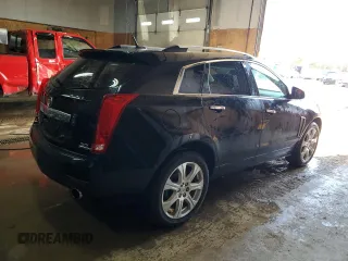 2014 Cadillac SRX Performance Collection z VIN 3GYFNFE31ES627978, wystawiony jako Copart lot #55437185 z przebiegiem 141 759 mil mil oraz Czysty tytuł • Clean title. Historia ofert i sprzedaży dostępna na DreamBid. Obrazek 3.