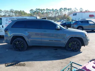 2021 Jeep Grand Cherokee Laredo E with VIN 1C4RJEAG3MC713511, listed as a IAAI auction lot 41235904 with 73,343 mi miles and . Bid and sale history available at DreamBid. Image 13.