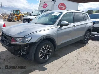 2021 Volkswagen Tiguan S with VIN 3VV1B7AX1MM070775, listed as a IAAI auction lot 41788112 with 22,107 mi miles and . Bid and sale history available at DreamBid. Image 2.