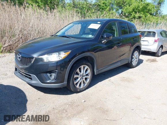 2013 Mazda CX-5 Grand Touring with VIN JM3KE4DE6D0127601, listed as a IAAI auction lot 42143558 with 95,719 mi miles and . Bid and sale history available at DreamBid. Image 19.