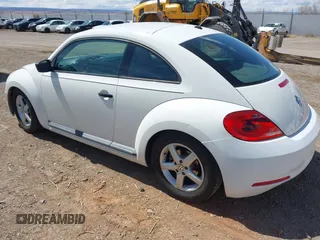 2012 Volkswagen Beetle Entry PZEV with VIN 3VWFP7AT2CM646744, listed as a IAAI auction lot 41963974 with 149,984 mi miles. Bid and sale history available at carsss.com. Image 3.