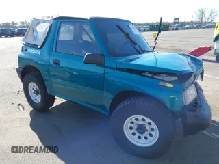 1996 Chevrolet Tracker z VIN 2CNBE1866T6936852, wystawiony jako IAAI lot #41812790 z przebiegiem 72 762 mil mil oraz . Historia ofert i sprzedaży dostępna na DreamBid. Obrazek 1.