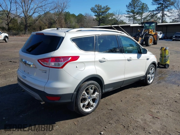 2014 Ford Escape Titanium with VIN 1FMCU9JX7EUD17335, listed as a IAAI auction lot 41302107 with 104,352 mi miles and . Bid and sale history available at DreamBid. Image 4.