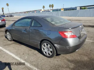 2010 Honda Civic Cpe LX with VIN 2HGFG1B61AH529839, listed as a Copart auction lot 69501724 with 218,443 mi miles and Salvage Title. Bid and sale history available at carsss.com. Image 2.