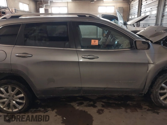 2015 Jeep Cherokee Limited with VIN 1C4PJLDB0FW505891, listed as a IAAI auction lot 41620674 with 120,804 mi miles and . Bid and sale history available at DreamBid. Image 13.