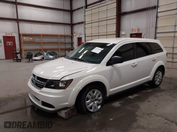 2015 Dodge Journey American Value z VIN 3C4PDCAB4FT714200, wystawiony jako IAAI lot #42199910 z przebiegiem 205 009 mil mil oraz . Historia ofert i sprzedaży dostępna na DreamBid. Obrazek 19.