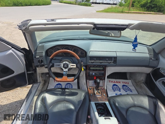 1999 Mercedes-Benz SL 500 with VIN WDBFA68FXXF184548, listed as a Copart auction lot 63814775 with 133,681 mi miles and Clean title. Bid and sale history available at DreamBid. Image 9.