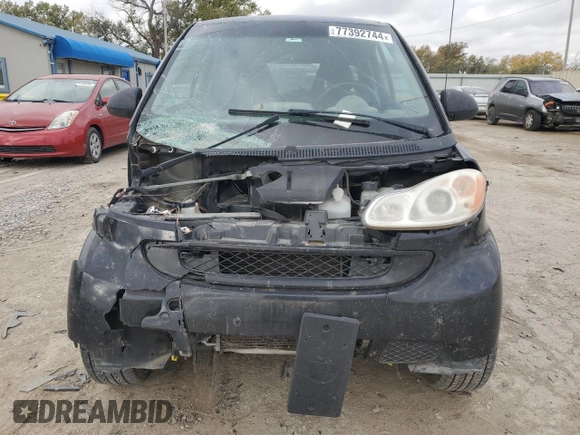 2009 Smart fortwo Pure with VIN WMEEJ31X19K267800, listed as a Copart auction lot 77392744 with 100,178 mi miles and Salvage Title. Bid and sale history available at carsss.com. Image 5.