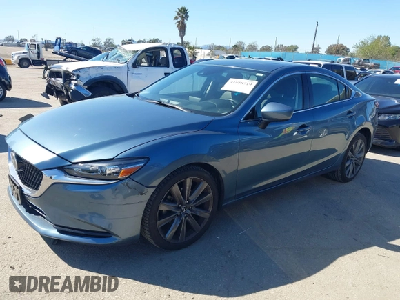 2018 Mazda 6 Grand Touring with VIN JM1GL1TY4J1333021, listed as a IAAI auction lot 41818719 with 56,188 mi miles and . Bid and sale history available at DreamBid. Image 14.