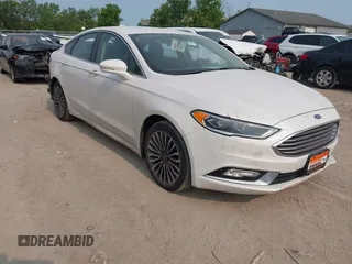 2017 Ford Fusion Titanium z VIN 3FA6P0K92HR396113, wystawiony jako IAAI lot #42402969 z przebiegiem 185 620 mil mil oraz . Historia ofert i sprzedaży dostępna na DreamBid. Obrazek 1.