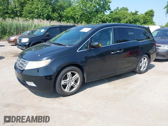 2011 Honda Odyssey Touring with VIN 5FNRL5H97BB073708, listed as a IAAI auction lot 42409164 with 141,986 mi miles and . Bid and sale history available at DreamBid. Image 2.