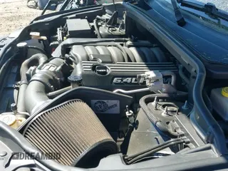 2014 Jeep Grand Cherokee SRT-8 z VIN 1C4RJFDJ7EC527372, wystawiony jako IAAI lot #41889040 z przebiegiem 120 015 mil mil oraz . Historia ofert i sprzedaży dostępna na DreamBid. Obrazek 19.