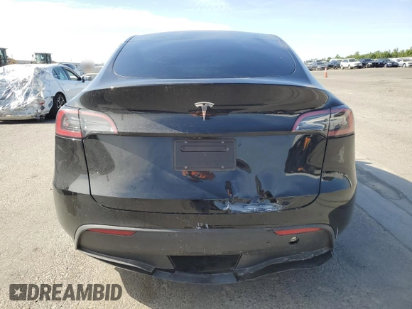 2024 Tesla Model Y with VIN 7SAYGDED0RF131495, listed as a Copart auction lot 56849765 with 10,120 mi miles and Salvage title. Bid and sale history available at DreamBid. Image 6.