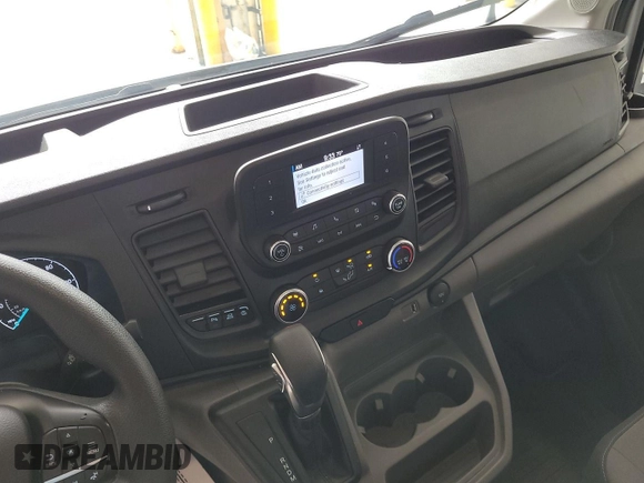 2023 Ford Transit Cargo with VIN 1FTBR1X86PKB99022, listed as a IAAI auction lot 42841650 with 14,234 mi miles and . Bid and sale history available at DreamBid. Image 14.