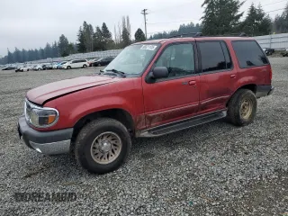 2000 Ford Explorer XLT with VIN 1FMDU73EXYZA10334, listed as a Copart auction lot 88321125 with 165,673 mi miles and Salvage Title. Bid and sale history available at DreamBid. Image 1.