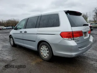 2010 Honda Odyssey LX z VIN 5FNRL3H20AB012805, wystawiony jako Copart lot #52243405 z przebiegiem 206 479 mil mil oraz Szkoda całkowita • Salvage title. Historia ofert i sprzedaży dostępna na DreamBid. Obrazek 2.