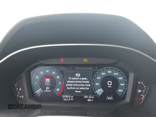 2020 Audi Q3 Premium z VIN WA1AECF32L1061271, wystawiony jako IAAI lot #42038795 z przebiegiem 23 902 mil mil oraz . Historia ofert i sprzedaży dostępna na DreamBid. Obrazek 7.