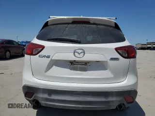 2015 Mazda CX-5 Touring with VIN JM3KE2CY5F0548826, listed as a Copart auction lot 52686565 with 139,602 mi miles and Salvage Title. Bid and sale history available at carsss.com. Image 6.