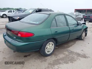 1999 Ford Escort LX z VIN 1FAFP10P1XW230023, wystawiony jako IAAI lot #42486934 z przebiegiem 41 468 mil mil oraz . Historia ofert i sprzedaży dostępna na DreamBid. Obrazek 4.