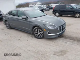 2022 Hyundai Sonata Hybrid Blue with VIN KMHL24JJ2NA048439, listed as a IAAI auction lot 40942477 with 64,855 mi miles. Bid and sale history available at carsss.com. Image 1.