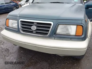 1997 Suzuki Sidekick z VIN JS3TD21V7V4109189, wystawiony jako IAAI lot #42526480 z przebiegiem 133 248 mil mil oraz . Historia ofert i sprzedaży dostępna na DreamBid. Obrazek 6.