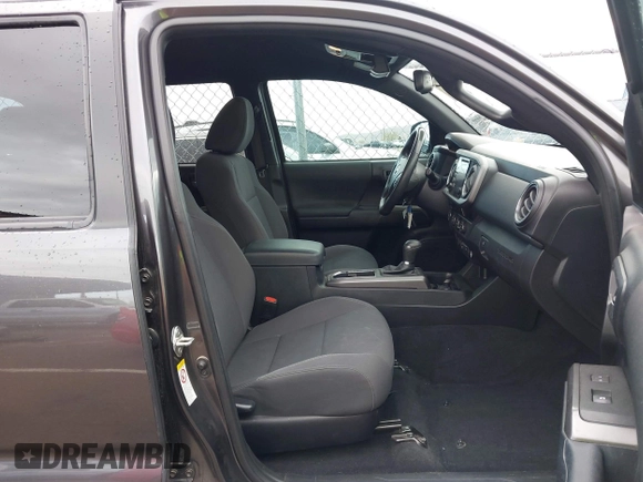 2018 Toyota Tacoma SR5 with VIN 3TMAZ5CN0JM061233, listed as a IAAI auction lot 41944668 with 94,314 mi miles and . Bid and sale history available at DreamBid. Image 5.