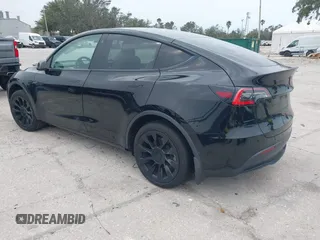 2021 Tesla Model Y Standard Range with VIN 5YJYGDED8MF123246, listed as a IAAI auction lot 41291676 with 74,630 mi miles and . Bid and sale history available at DreamBid. Image 3.