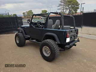 1995 Jeep Wrangler S with VIN 1J4FY19PXSP218282, listed as a Copart auction lot 63527435 with 160,957 mi miles and Clean title. Bid and sale history available at DreamBid. Image 3.