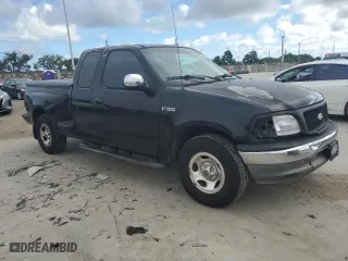 2002 Ford F-150 XL with VIN 2FTRX07222CA18022, listed as a Copart auction lot 80419784 with 283,975 mi miles and Salvage Title. Bid and sale history available at carsss.com. Image 4.